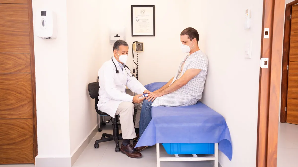 A patient talking with a doctor during a clinic consultation